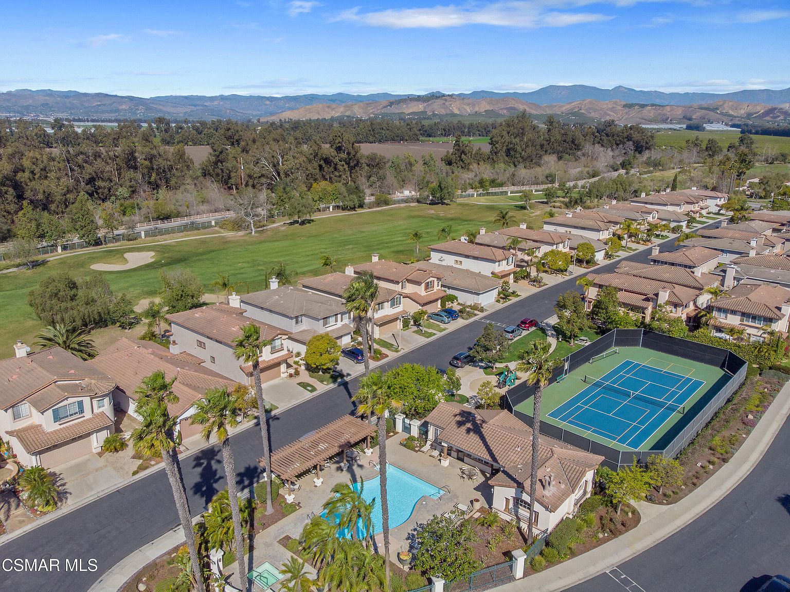 Aerial view of The Fairways at Sterling Hills, the gated community where 2872 La Plata Drive sits, with the championship golf course, clubhouse, mountain backdrop, and resort amenities visible.
