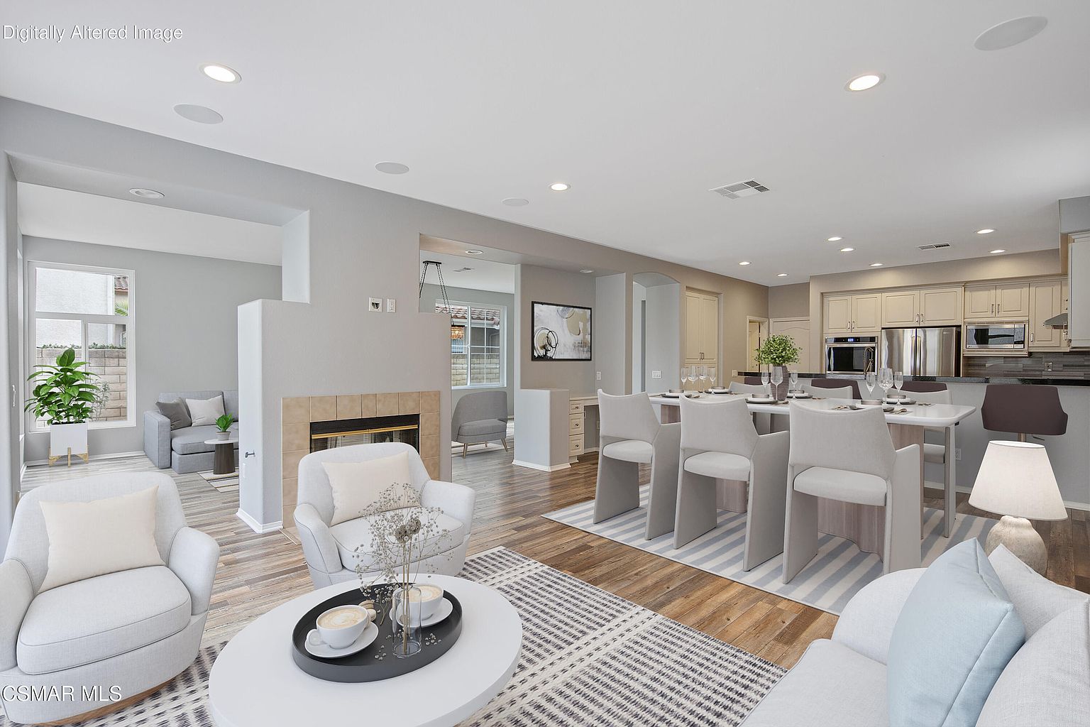 Open dining and living area with kitchen island visible.